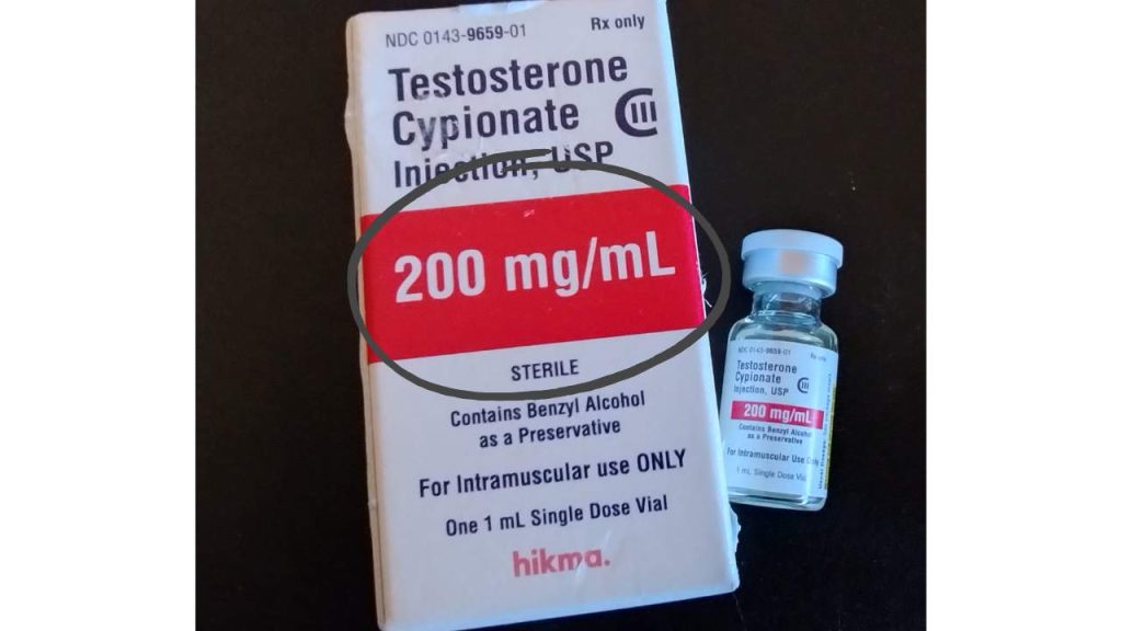 A 1mL vial of testosterone cypionate injection, USP by hikma with the box it came in.  The concentration of the solution (200 mg/mL) is circled in the image. | QueerDoc syringes